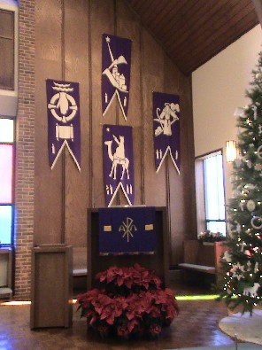 Weekly Advent banners behine the pulpit
