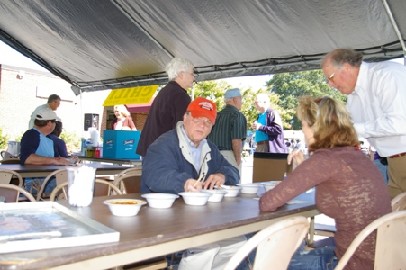 The judges ponder over all the chili samples