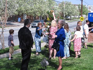 Congregation placing flowers on the cross